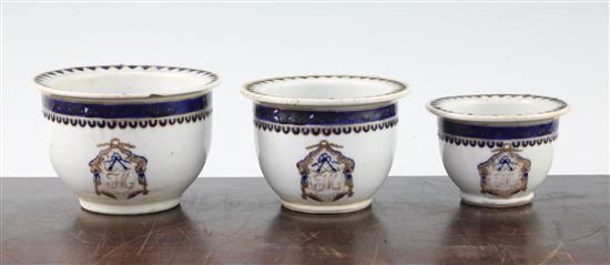 An unusual set of three graduated Chinese export enamelled porcelain flower pots, early 19th century, largest 11.5cm